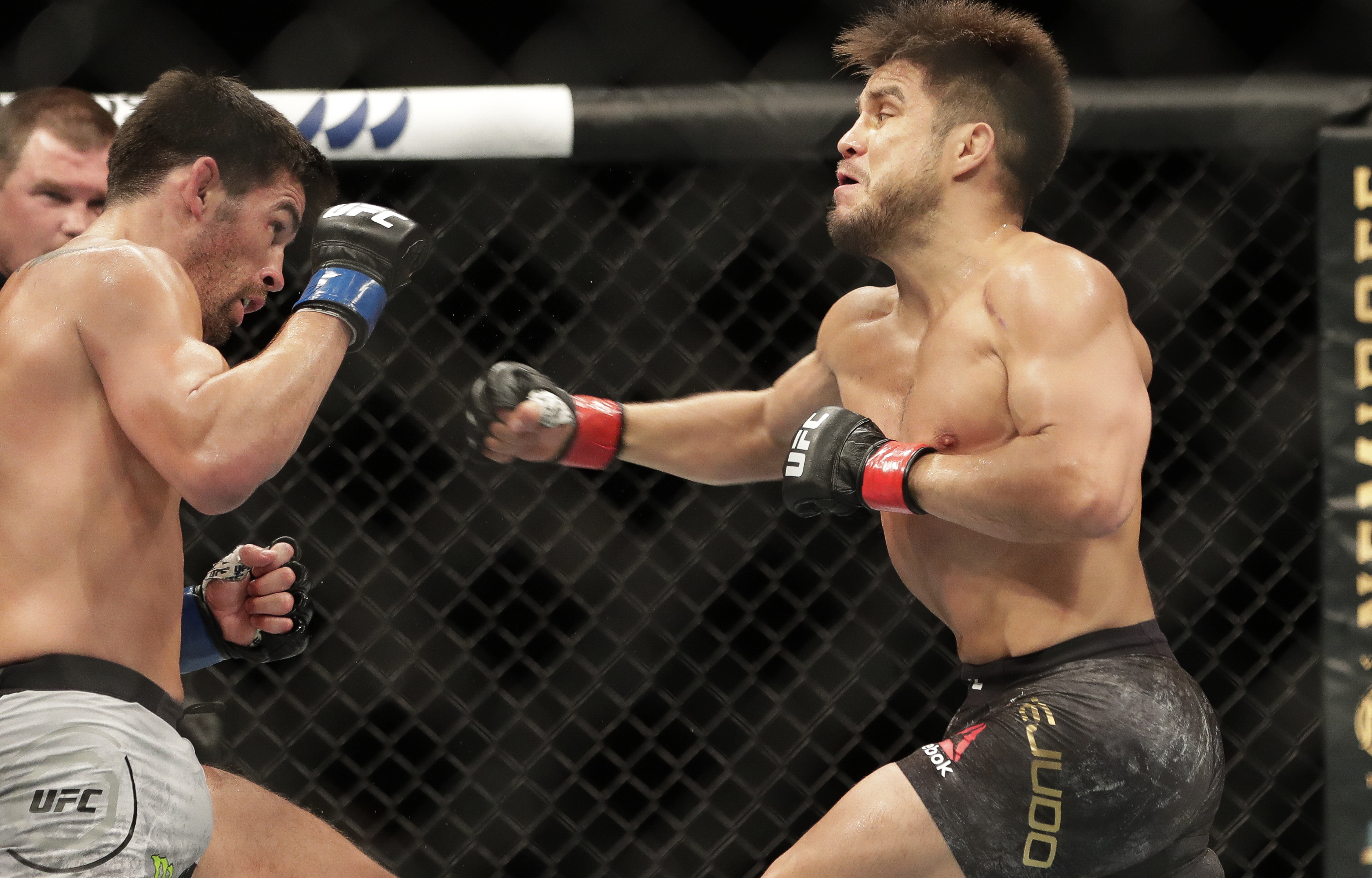AP photo by John Raoux / Henry Cejudo, right, punches Dominick Cruz during a UFC 249 bout Saturday night in Jacksonville, Fla. (AP Photo/John Raoux)
