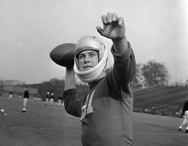 AP photo / Georgia halfback Frank Sinkwich poses for a photo in 1941, when as a junior he set the SEC's single-season rushing record with 1,103 yards despite playing much of the season with a broken jaw that required a bulky guard for his face.