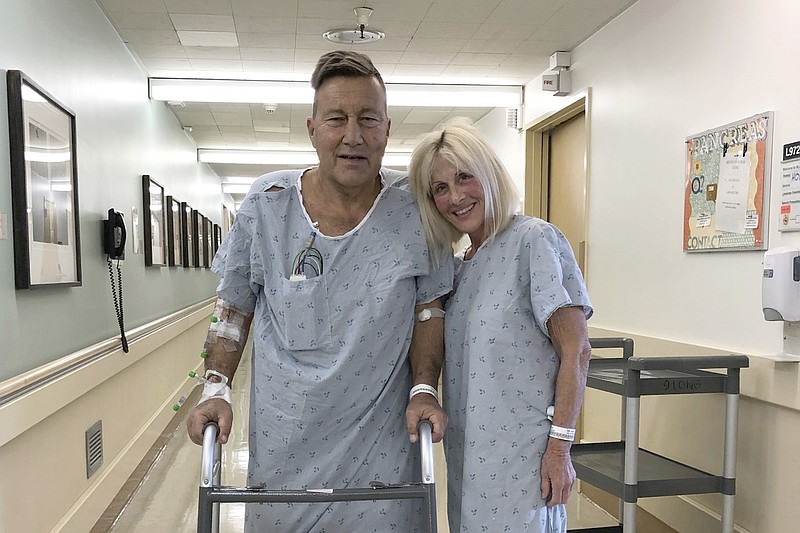 This April 1, 2020 photo provided by Herb Hoeptner shows him and his wife, Diane, at the UCSF hospital in San Francisco the day after surgery to donate one of her kidneys to him. Organ transplants have plummeted as COVID-19 swept through communities. But the team led by Dr. Chris Freise, interim transplant director at the University of California, San Francisco, allowed living kidney transplants for people like Herb Hoeptner, who was on the brink of needing dialysis. "When you have kidneys that have nothing left, you either go on dialysis or you die. That was much more of a concern to me than coronavirus," said Hoeptner. (Courtesy Herb Hoeptner via AP)


