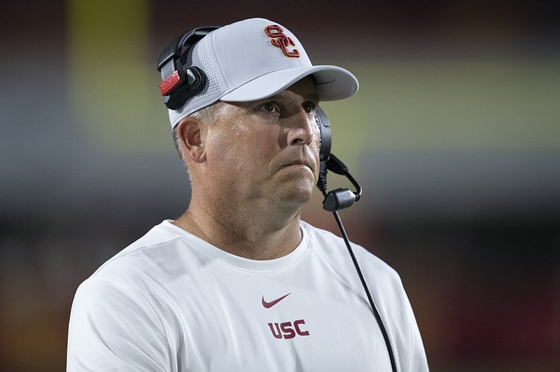 AP photo by Kyusung Gong / University of Southern California football coach Clay Helton watches his team's game against Fresno State on Sept. 31, 2019, in Los Angeles. The USC Trojans are part of the Pac-12.