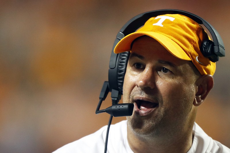 AP photo by Wade Payne / Tennessee football coach Jeremy Pruitt talks to a player during the second half of last September's home against Georgia.