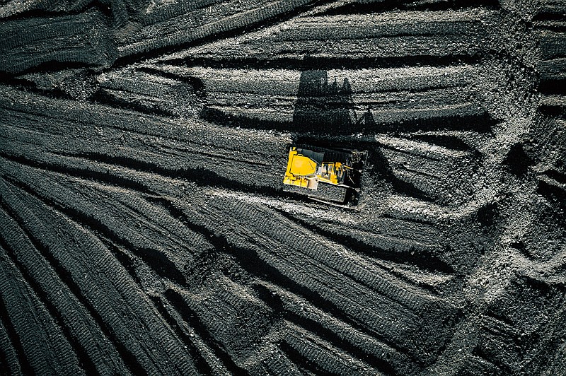 Open pit mine. Aerial view of extractive industry for coal. Top view. Photo captured with drone. - stock photo coal tile / Getty Images
