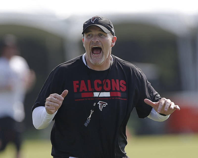 AP file photo / Atlanta Falcons coach Dan Quinn has maintained a positive outlook despite the unprecedented challenges the coronavirus pandemic has brought to all NFL teams this offseason.