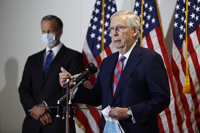 Photo by Patrick Semansky of The Associated Press / Senate Majority Leader Mitch McConnell of Kentucky, speaks at a news conference on Capitol Hill in Washington on Tuesday, May 12, 2020. Standing behind McConnell is Senate Majority Whip John Thune, R-South Dakota.