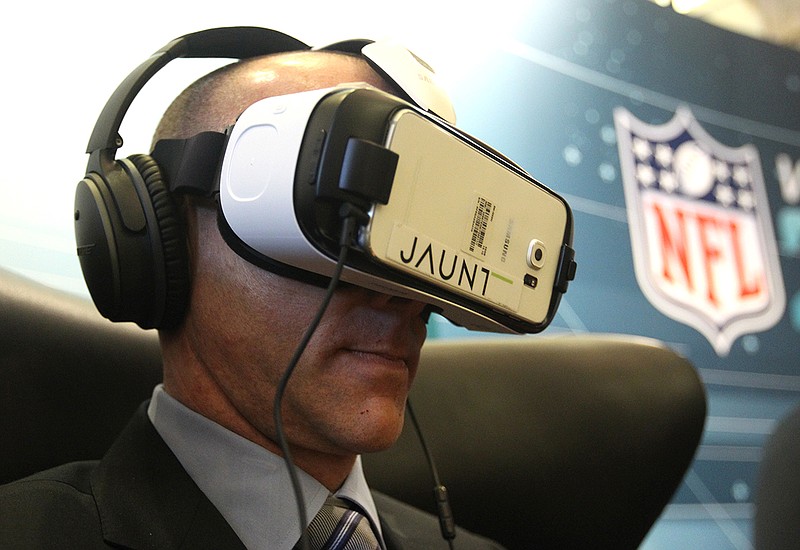 AP photo by Luis M. Alvarez / Philadelphia Eagles president Don Smolenski wears a virtual reality headset at a meeting of NFL team owners on March 22, 2016, in Boca Raton, Fla. The virtual world — though not necessarily with the type of gear worn by Smolenski — has become reality for the league's team's this offseason during the coronavirus pandemic.