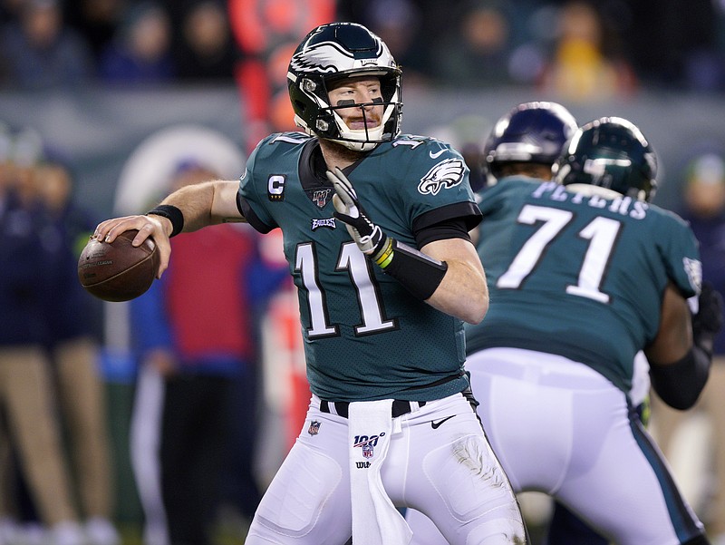 AP file photo by Chris Szagola / Carson Wentz said he isn't worried about the Philadelphia Eagles having used a first-round draft pick on quarterback Jalen Hurts during last month's NFL draft.