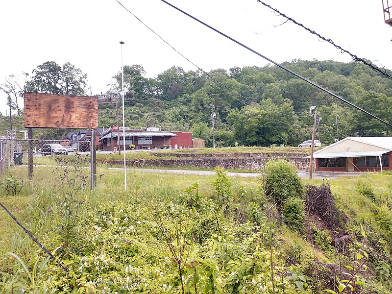 Nikki's Drive-Inn is shown in the background overlooking an adjacent parcel where a Chattanooga developer plans to build a 10-unit townhouse complex. / Staff photo by Mike Pare
