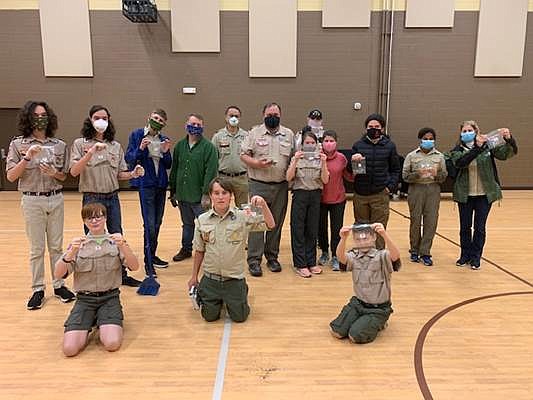 Contributed photo / Signal Mountain Boy Scout Troops 1116 and 116 and their parents filled 800 bags of fertilizer to go with hundreds of cherry blossom trees that were given away on Arbor Day to area tornado victims.