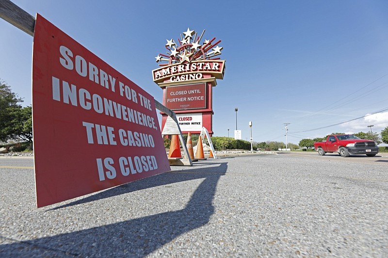 Traffic passes the closed Ameristar Casino in Vicksburg, Miss., Tuesday, March 17, 2020. All of Mississippi's state-regulated casinos were ordered closed by midnight Monday to limit the spread of the new coronavirus. (AP Photo/Rogelio V. Solis)


