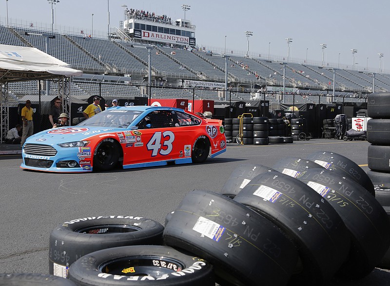 AP photo by Terry Renna / NASCAR driver Aric Almirola heads for the track during a Cup Series practice on Sept. 4, 2015, at South Carolina's Darlington Raceway, the venue that will host NASCAR's return to competition after a two-month layoff this Sunday.