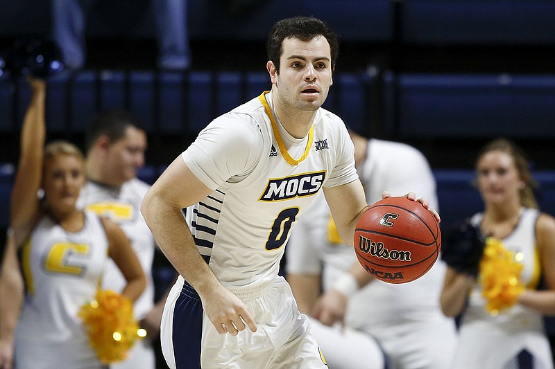 Staff photo by C.B. Schmelter / UTC's A.J. Caldwell dribbles during a home game against Cumberland University last Dec. 29. Caldwell, who will be a redshirt junior in the 2020-21 season, is going from walk-on to scholarship player for the Mocs.