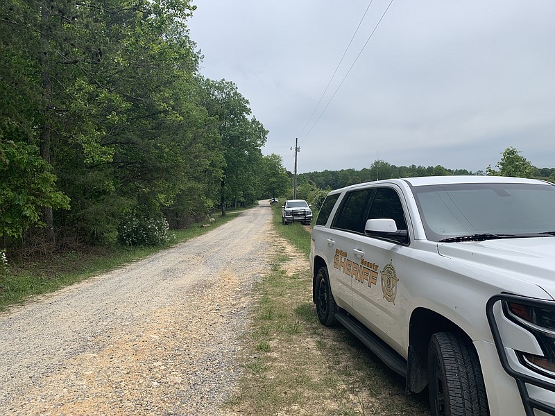 Photo contributed by the DeKalb County (Ala.) Sheriff's Office / DeKalb County Sheriff's Office patrol vehicles are shown at a search location near Mentone, Ala., where a contractor found human remains on Tuesday.