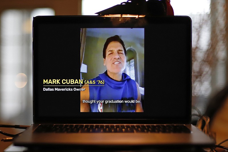 FILE - In this April 26, 2020, file photo, University of Pittsburgh graduate Dallas Mavericks owner Mark Cuban congratulates members of the Class of 2020 during a virtual commencement on a computer screen in Pittsburgh. As the coronavirus leaves colleges holding "virtual graduation" events online, many schools are recruiting famous figures to deliver speeches over their laptops instead of the lectern. (AP Photo/Gene J. Puskar, File)