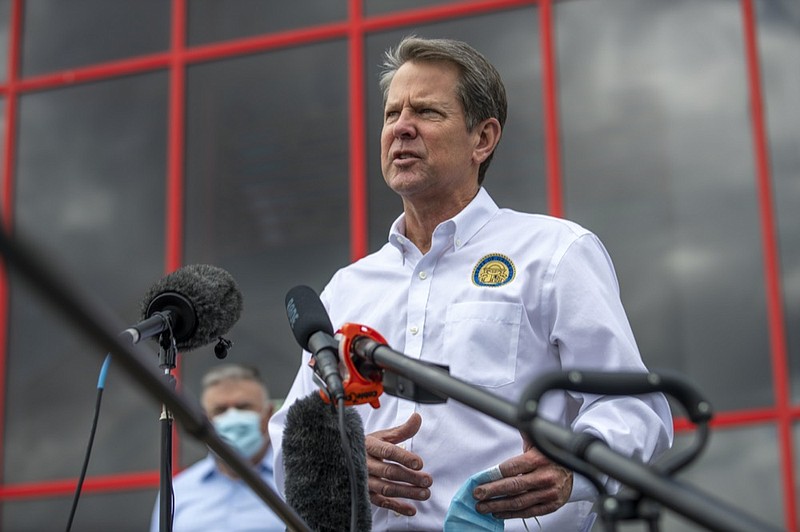 Atlanta Gov. Brian Kemp makes a statement and answers questions from the media following a tour of Fieldale Farms while visiting Gainesville, Ga., Friday, May 15, 2020. (Alyssa Pointer/Atlanta Journal-Constitution via AP)


