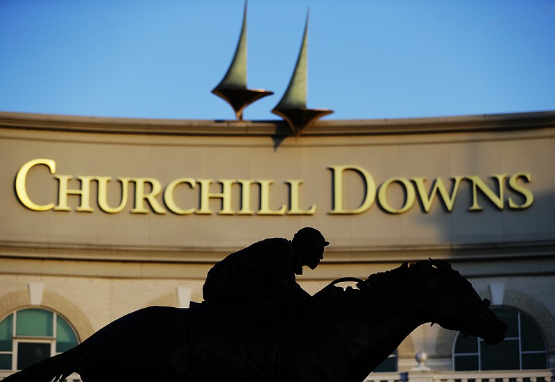 AP photo by Darron Cummings / A statue of Barbaro is silhouetted at the entrance of Churchill Downs on May 6 in Louisville, Ky. The Kentucky Derby, normally held the first Saturday of May, was pushed to September this year because of the coronavirus pandemic.