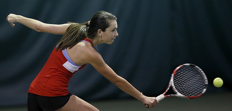 Staff photo by C.B. Schmelter / Baylor's Carolyn Reid stretches to return the ball in a singles match against GPS player Corinne Spann during the Chattanooga Rotary Tennis Tournament on April 6, 2018, at Baylor. Reid and fellow Baylor seniors Defne Bozeby, Anna Hawkins and Grace Mooney had hoped to end their prep tennis careers with a 10th straight team state championship, but the cancellation of the Spring Fling took away that opportunity.