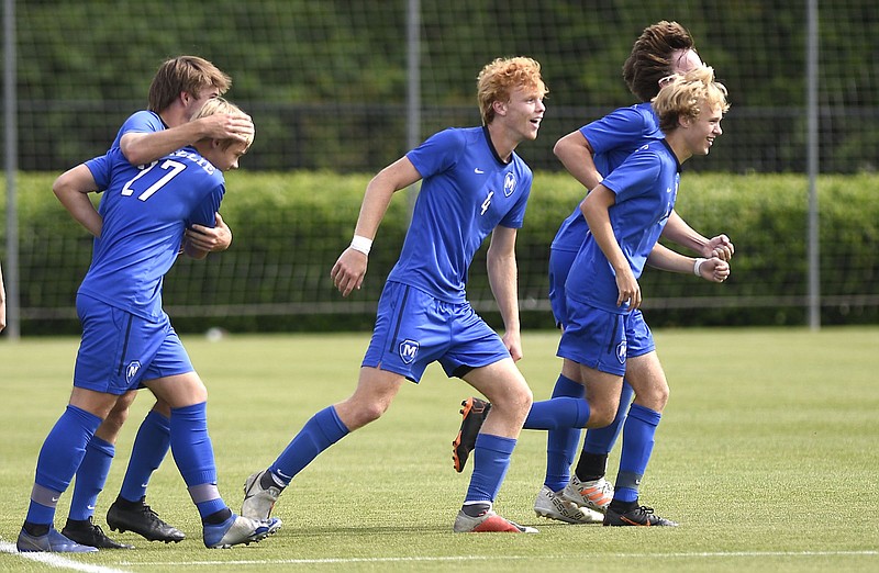 Staff photo by Robin Rudd / McCallie soccer players celebrate a goal during their 2-0 victory over Montgomery Bell Academy to win the TSSAA Division II-AA state title on May 23, 2019, at the Richard Siegel soccer complex.