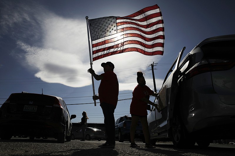 FILE - In this May 12, 2020, file photo, members of the Culinary union prepare before a car caravan rally in Las Vegas. The union is asking for casino companies to make their full safety guidelines and reopening plans public. (AP Photo/John Locher, File)


