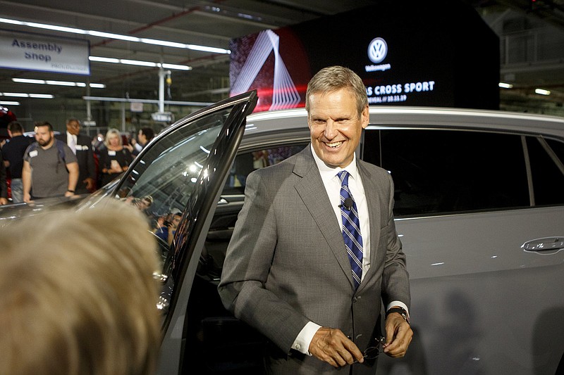 Staff Photo By C.B. Schmelter / Gov. Bill Lee smiles in 2019 after checking out an Atlas Cross Sport at the Volkswagen Assembly Plant, which restarted its assembly line Sunday after being shut down during the COVID-19 virus.