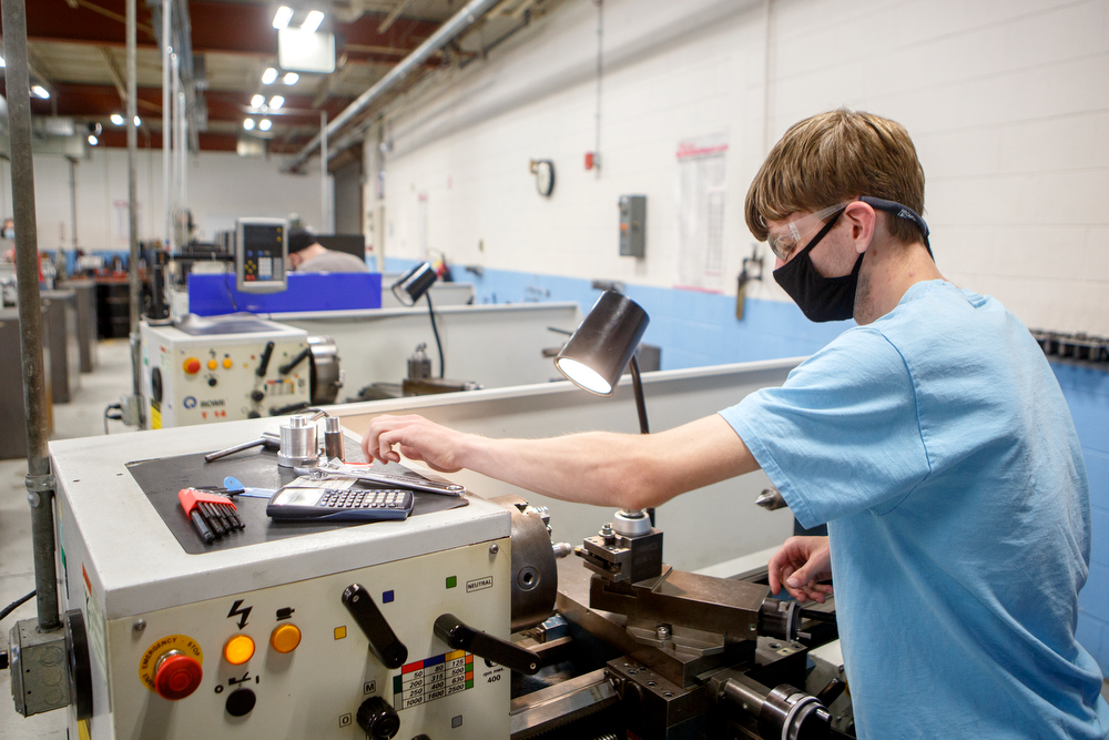 Staff photo by C.B. Schmelter / Student Jacob Roerdink works in the Machine Tool Lab in the TCAT 2 Building on the campus of Chattanooga State Community College on Tuesday, May 19, 2020 in Chattanooga, Tenn. While most classes at the college have continued online, a few classes began instruction on campus on Monday.