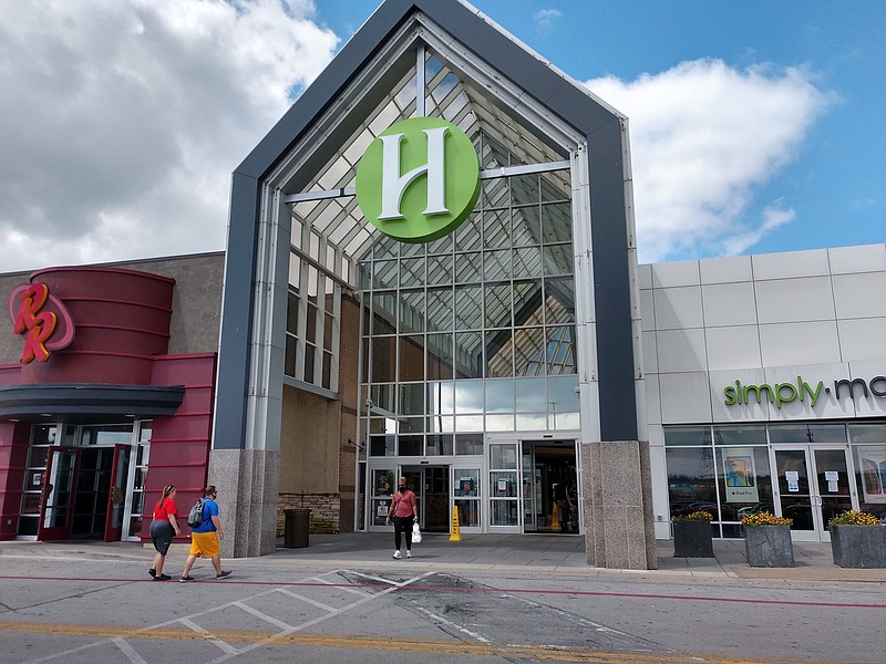 Staff photo by Mike Pare / Shoppers walk in and out of one of the entrances at Hamilton Place mall on Tuesday. Mall owner CBL Properties says 75% of stores inside the mall have reopened.