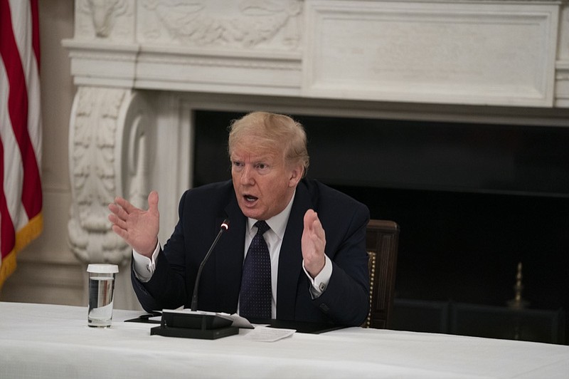 President Donald Trump speaks during a meeting with restaurant industry executives about the coronavirus response, in the State Dining Room of the White House, Monday, May 18, 2020, in Washington. (AP Photo/Evan Vucci)


