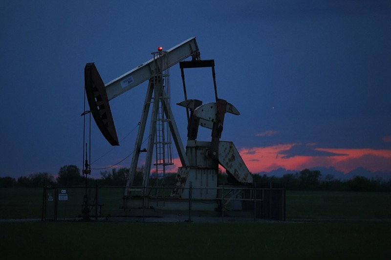 FILE In this April 21, 2020 file photo, a pumpjack is pictured as the sun sets in Oklahoma City. Google says it won't build custom artificial intelligence tools for speeding up oil and gas extraction, taking an environmental stance that distinguishes it from cloud computing rivals Microsoft and Amazon. The announcement followed a Greenpeace report on Tuesday, May 19, that documents how the three tech giants are using AI and computing power to help oil companies find and access oil and gas deposits in the U.S. and around the world. (AP Photo/Sue Ogrocki File)


