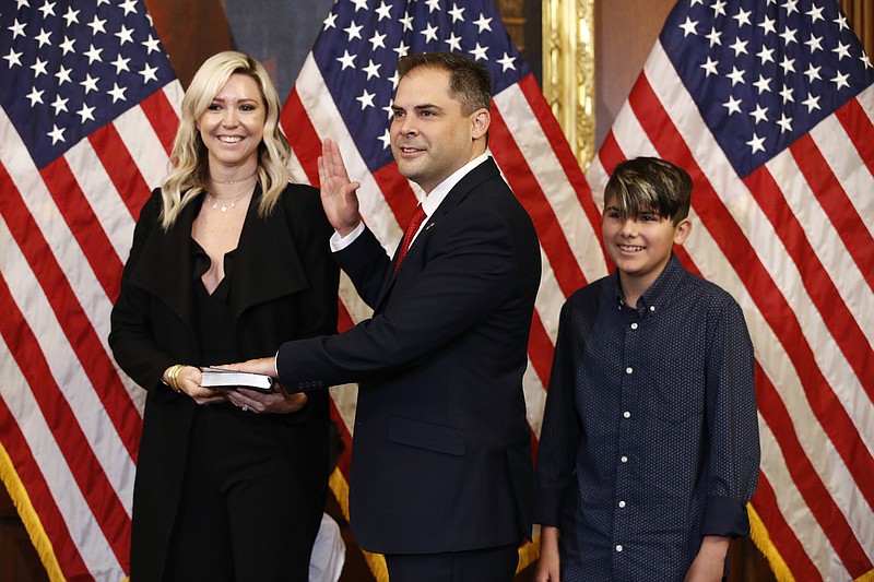 Rep. Mike Garcia, R-Calif., center, joined by his wife Rebecca and son Preston, participates in a ceremonial swearing-in with House Speaker Nancy Pelosi of Calif., on Capitol Hill in Washington, Tuesday, May 19, 2020. (AP Photo/Patrick Semansky)


