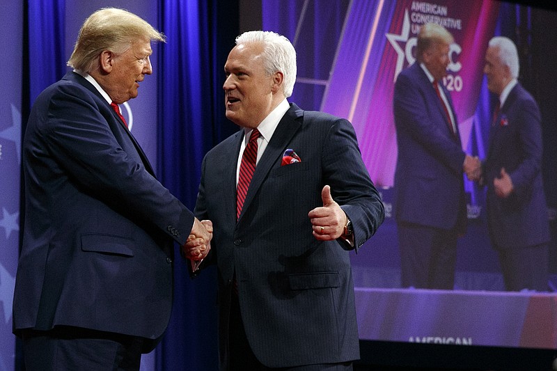 FILE - In this Feb. 29, 2020, file photo, President Donald Trump is greeted by Matt Schlapp, Chairman of the American Conservative Union, as the president arrives to speak at the Conservative Political Action Conference, at National Harbor, in Oxon Hill, Md. (AP Photo/Jacquelyn Martin, File)


