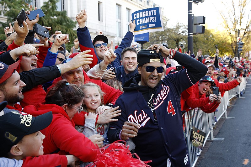 AP photo by Patrick Semansky / Washington Nationals manager Dave Martinez gets close to fans during a parade to celebrate the franchise's first World Series title on Nov. 2, 2019, in Washington, D.C.