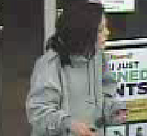 Dalton police are searching for a woman they say used a credit card stolen from a car to buy gas, cigarettes and vaping products. Surveillance video from the stores shows the same woman made both purchases with the stolen card. She is white and was wearing a gray hooded sweatshirt and camouflage pants with bright purple or blue tennis sneakers. She was also seen driving a a mid-2000s model Nissan Altima with drive out tags and some damage to the rear. / Photo from the Dalton Police Department