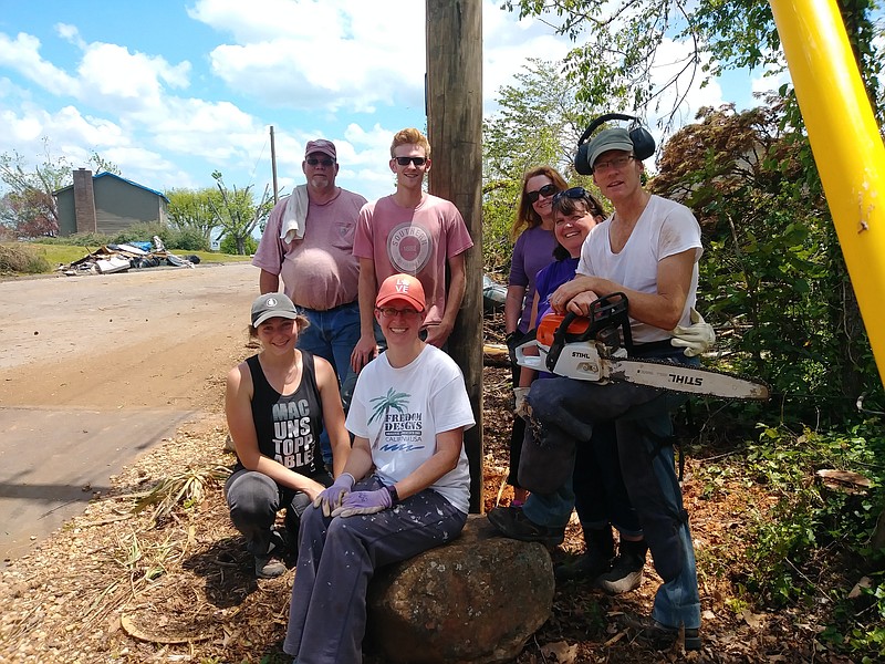 Contributed photo / A group of volunteers helped with storm cleanup weeks after a fierce tornadoes damaged Shelby Watson's neighborhood. Neighbors and volunteers removed huge trees and debris, supplying food and bottled water to storm victims.