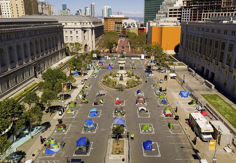 Rectangles designed to help prevent the spread of the coronavirus by encouraging social distancing line a city-sanctioned homeless encampment at San Francisco's Civic Center on Thursday, May 21, 2020. (AP Photo/Noah Berger)


