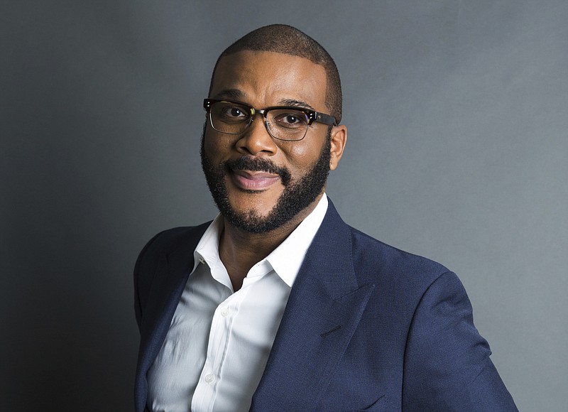 Actor-filmmaker and author Tyler Perry poses for a portrait in New York. Perry is looking to reopen his 330-acre Atlanta-based mega studio soon, but other studios in Georgia are anxiously waiting for Hollywood's green light to return back to work. Perry plans on restarting production at the Tyler Perry Studios complex in July, making it one of the first studios to domestically reopen after production was halted a few months ago to combat the spread of the coronavirus. (Photo by Amy Sussman/Invision/AP, File)