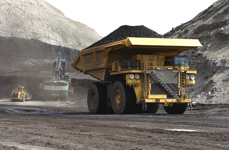 FILE - In this April 4, 2013 file photo, a truck carrying 250 tons of coal hauls the fuel to the surface of the Spring Creek mine near Decker, Mont. A judge threw out a lawsuit on Friday, May 22, 2020, from a coalition of states, environmental groups and American Indians which sought to revive an Obama-era moratorium against U.S. government coal sales on public lands in the West. U.S. District Judge Brian Morris said President Donald Trump's administration had fixed its initial failure to consider the environmental impacts of ending the moratorium. (AP Photo/Matthew Brown,File)


