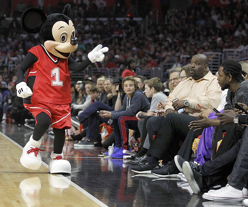 AP photo by Alex Gallardo / Mickey Mouse, left, entertains fans as the Los Angeles Clippers host the Cleveland Cavaliers on March 13, 2016.