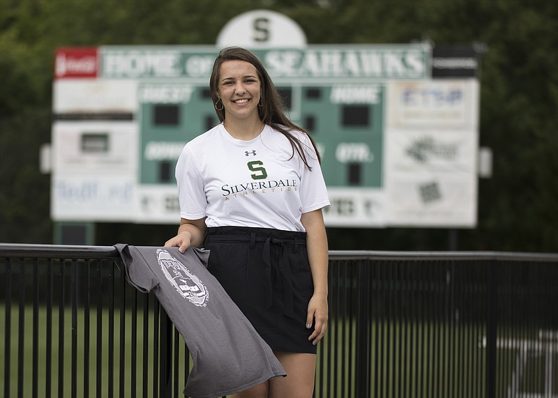 Staff photo by Troy Stolt / Silverdale Baptist Academy senior Carrie Patrick, who ran track and played soccer for the Lady Seahawks, designed and sold T-shirts to raise funds that will help Grace Baptist Academy rebuild after the K-12 school and church experienced major damage during an April 12 tornado.