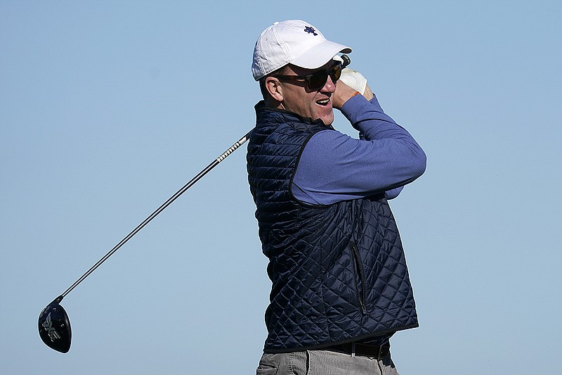 AP photo by Tony Avelar / Former University of Tennessee and NFL quarterback Peyton Manning follows through after teeing off on the 16th hole of the Shore Course at Monterey Peninsula Country Club during the second round of the AT&T Pebble Beach National Pro-Am on Feb. 7 in California.