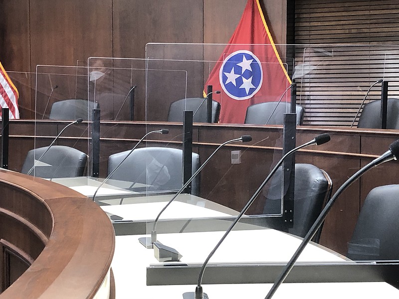 Staff photo by Andy Sher / Newly installed plexiglass panels provide physical separation between representatives at the state Capitol building in Nashville. Similar panels have been erected for all 99 state House members' desks in the House chamber.