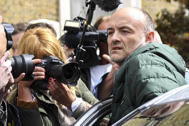 Britain's Prime Minister Boris Johnson's senior aid Dominic Cummings leaves his home, in London, Sunday, May 24, 2020. Several lawmakers from Britain's governing Conservative Party have joined opposition calls for Johnson's top aide to be fired for flouting lockdown rules. Dominic Cummings traveled 250 miles (400 kms) to his parents' home with his wife and son as he was coming down with COVID-19 at the end of March. (AP Photo/Alberto Pezzali)