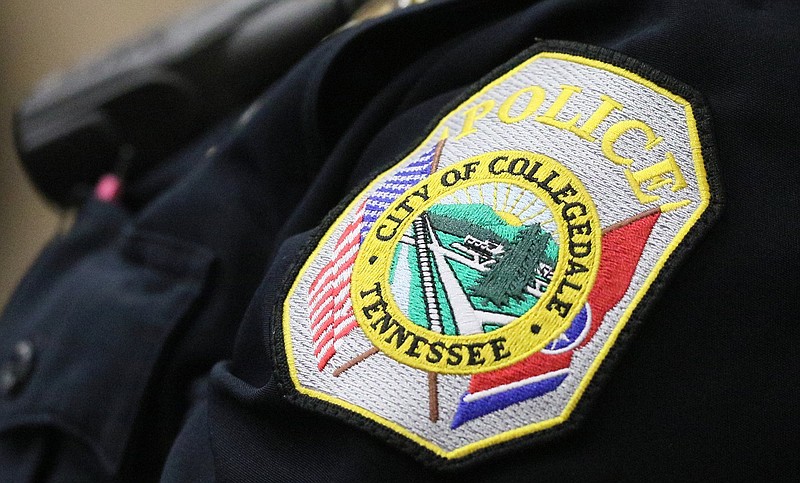 Staff photo by Erin O. Smith / A Collegedale Police Department patch is seen on the shoulder of an officer during the Collegedale Commission meeting at Collegedale City Hall Monday, November 18, 2019 in Collegedale, Tennessee. The Municipal Technical Advisory Service shared its independent assessment of the city's public works and police departments during the meeting.