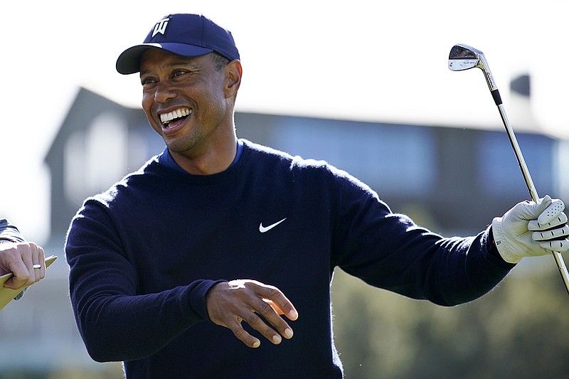 AP photo by Ryan Kang / Tiger Woods smiles after teeing off on the 16th hole during the Genesis Invitational pro-am on Feb. 12 at Riviera Country Club in Los Angeles. Woods and former University of Tennessee and NFL quarterback Peyton Manning teamed up to defeat PGA Tour rival Phil Mickelson and six-time Super Bowl champion Tom Brady in a charity golf match Sunday in Florida.