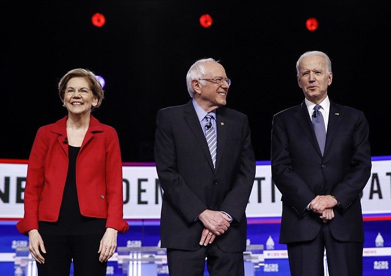 FILE - In this Feb. 25, 2020, file photo from left, Democratic presidential candidates, Sen. Elizabeth Warren, D-Mass., Sen. Bernie Sanders, I-Vt., former Vice President Joe Biden, and Sen. Amy Klobuchar, D-Minn., participate in a Democratic presidential primary debate in Charleston, S.C. Calls for pragmatic centrism helped Joe Biden clinch the Democratic presidential nomination. But they left many of the party's strongest liberals worried that little progress would be made toward their sweeping goals. (AP Photo/Matt Rourke, File)