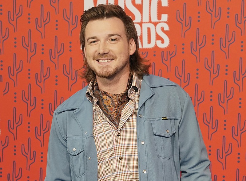 FILE - In this June 5, 2019, file photo, Morgan Wallen arrives at the CMT Music Awards on at the Bridgestone Arena in Nashville, Tenn. Country music singer Wallen has apologized following his weekend arrest on public intoxication and disorderly conduct charges. News outlets report the 27-year-old Wallen was arrested Saturday, May 23, 2020, after he was kicked out of Kid Rock's bar in downtown Nashville. (AP Photo/Sanford Myers, File)