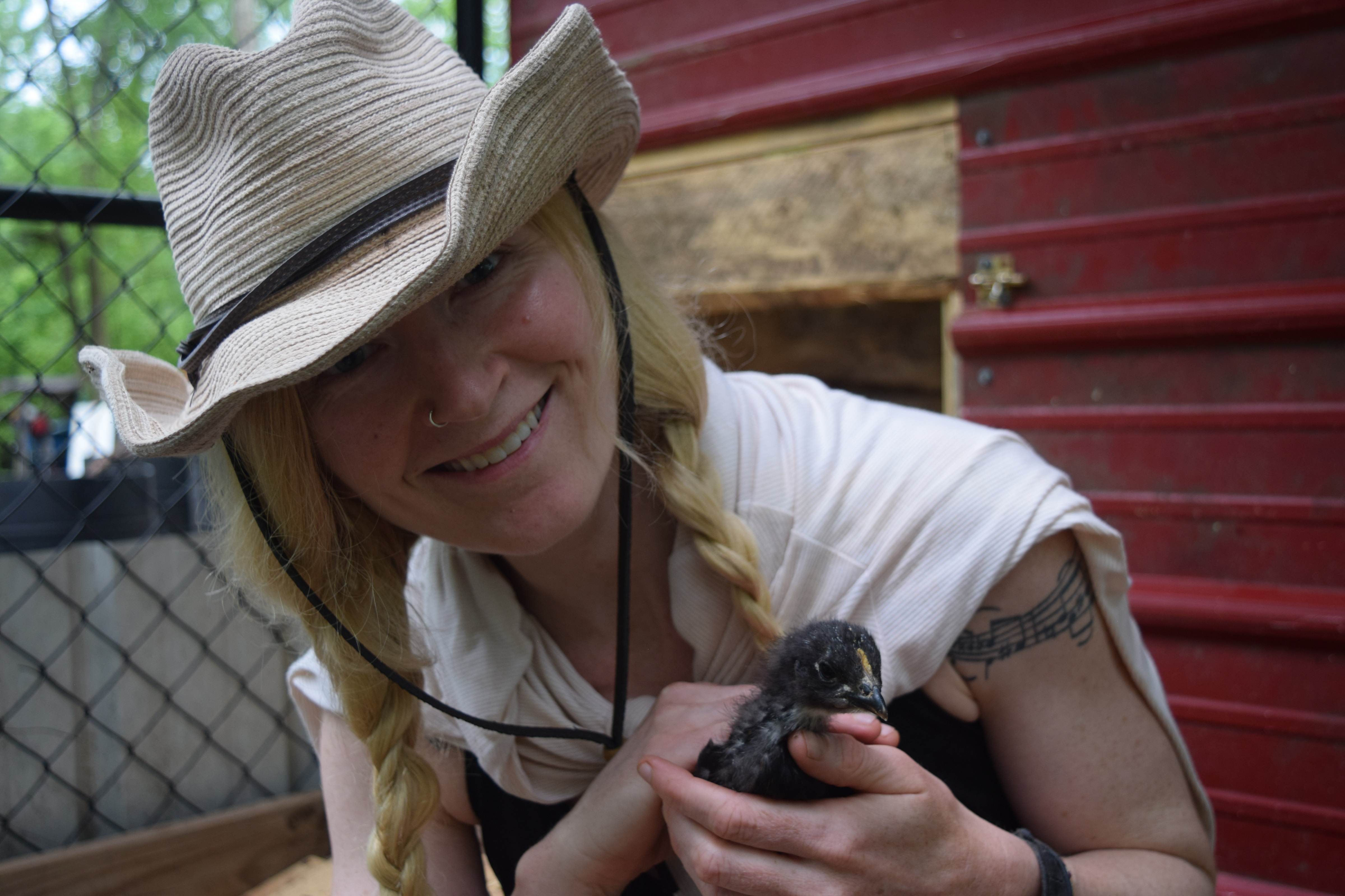 The author is pictured with her favorite chick, who she suspects may be a rooster due to its bold personality. / Photo by Alex Vargas