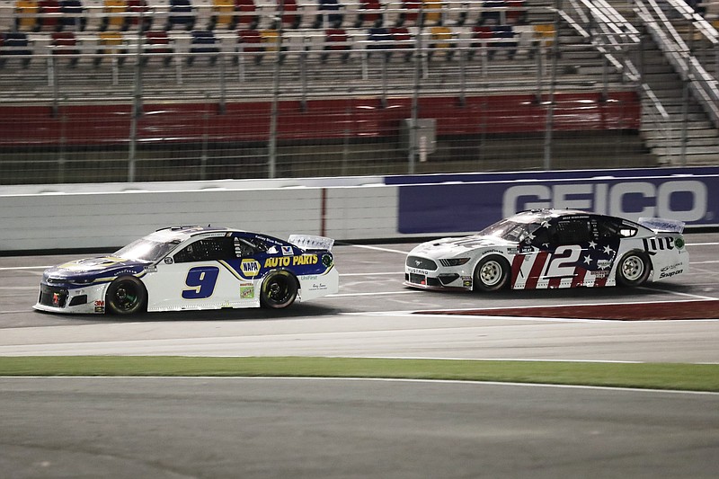 AP photo by Gerry Broome / Chase Elliott races ahead of Brad Keselowski during the NASCAR Cup Series' Coca-Cola 600 on Sunday night at Charlotte Motor Speedway in Concord, N.C.
