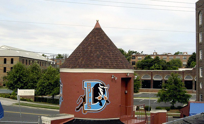 AP file photo by Karen Tam / The Durham Bulls' logo is displayed on the tower at the main gate of the historic Durham (N.C.) Athletic Park, where the 1988 baseball romantic comedy "Bull Durham" was filmed.