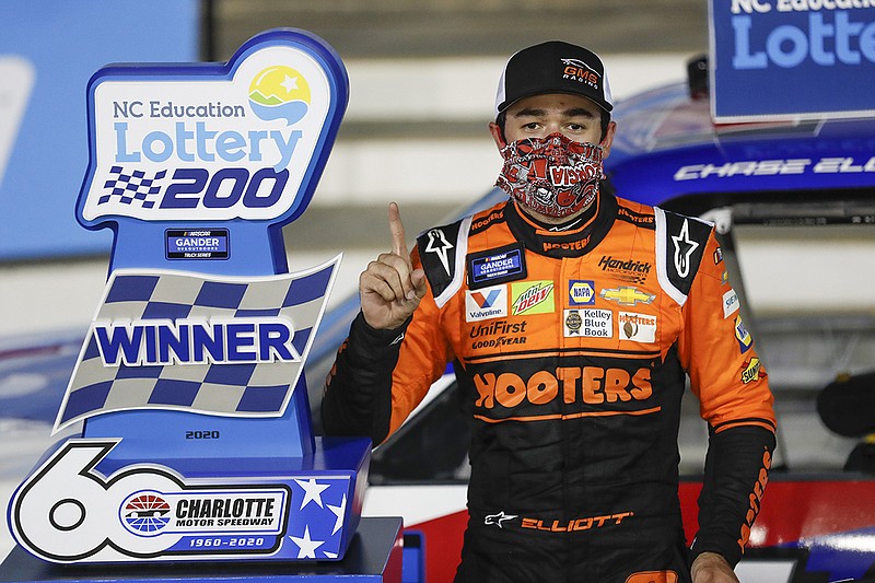 AP photo by Gerry Broome / NASCAR driver Chase Elliott celebrates after winning the Truck Series race Tuesday night at Charlotte Motor Speedway in Concord, N.C.