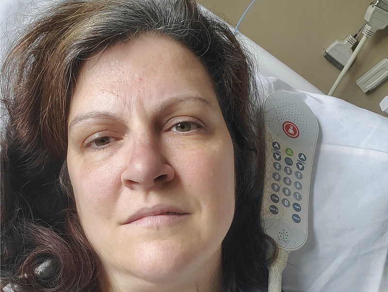 This May 6, 2020 photo provided by Darlene Gildersleeve, 43, of Hopkinton, N.H. shows her at a Manchester, N.H. hospital. Gildersleeve thought she had recovered from COVID-19. Doctors said she just needed rest. And for several days, no one suspected her worsening symptoms were related — until a May 4 video call, when her physician heard her slurred speech and consulted a specialist. "You've had two strokes,'' a neurologist told her at the hospital. (Darlene Gildersleeve via AP)


