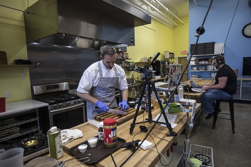 Staff photo by Troy Stolt / Instructor Jeff Pennypacker teaches a cooking class through the video call app Zoom at the Sweet and Savory Classroom located at 45 E Main Street on Tuesday, April 21, 2020 in Chattanooga, Tenn.